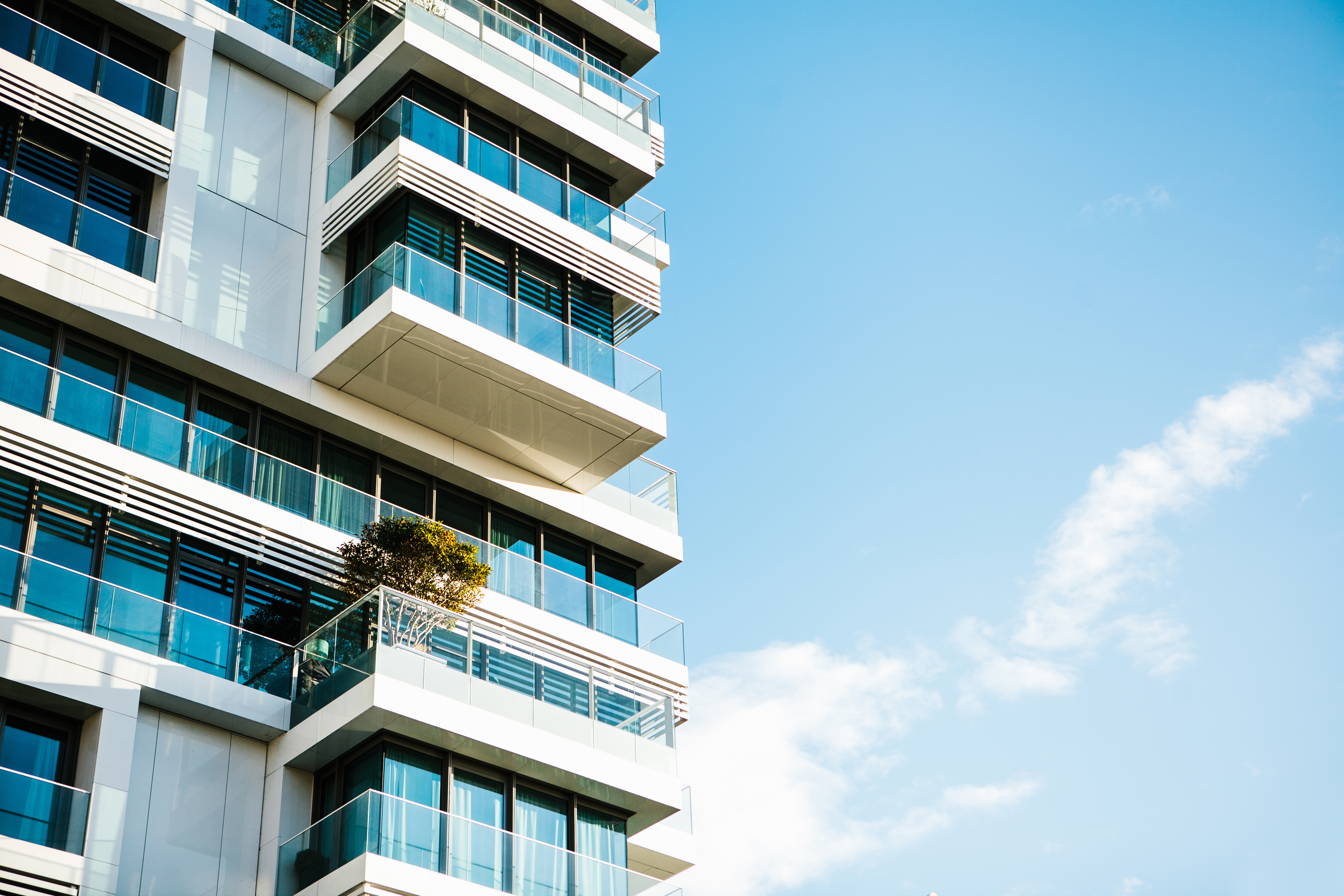 Building exterior, windows and blue sky.